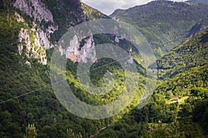 Extreme adrenaline rush in Montenegro, zipline. A steep and high descent above the river, a beautiful view of the canyon opens up