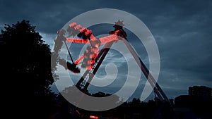 Extreme attraction in Lunapark, with different lights, filmed in dark in work