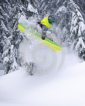 Extreme Backcountry Snowboard Jump Board Grab in Powder Spray