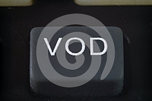 Extreme cloesup of a VOD button on a TV remote