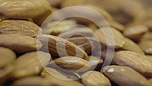Extreme close-up of almond nuts in grocery. Healthful raw food for people with lactose intolerance and vegetarians