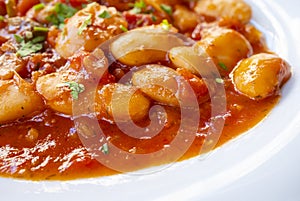 Extreme Close-up of Big Fava Beans Cooked in Tomato Sauce