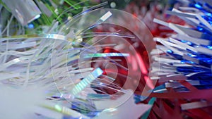 extreme close-up, detailed, bright shiny metallic tinsel. christmas background