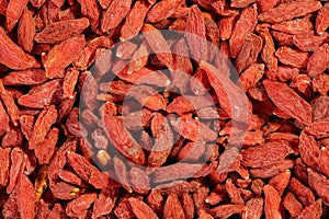 Extreme close up of dried organic goji berry fruits wolfberries. Macro texture food background