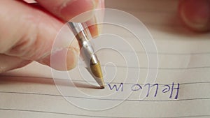 Extreme close-up of a hand with a pen