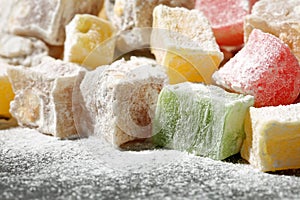 Extreme close up of a heap of many, multi colored turkish delight candies (lokum