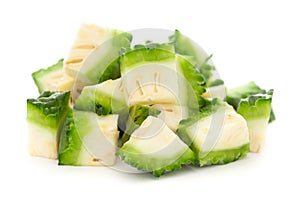 Extreme Close-Up of Organic Indian bitter gourds Momordica charantia or fresh Green Karela, chopped, diced or sliced, isolated