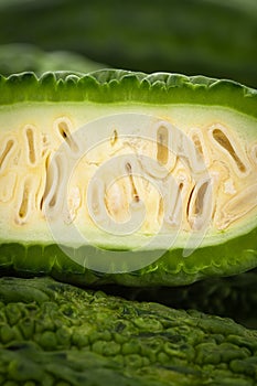 Extreme Close-Up of Organic Indian bitter gourds Momordica charantia or fresh Green Karela, cross section or sliced, isolated