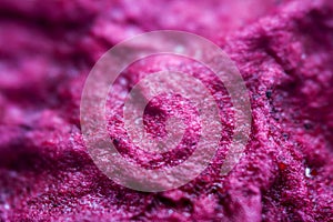 Extreme close up of purple handmade paper clay with a structure and rough texture