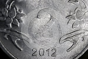 Extreme close up shot of silver Indian two rupee coin