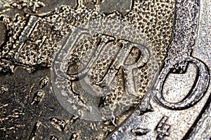 Extreme close up to a 2 euro coin. The big euro character in the center