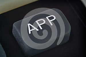 Extreme closeup of an app button on a remote