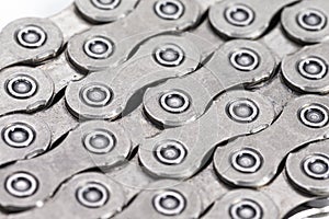 Extreme Closeup Background Texture of New Good Oiled Roller Bicycle Chain