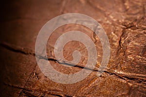 Extreme closeup of crumpled brass foil texture