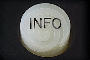 Extreme closeup of a info button on a remote