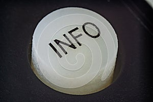Extreme closeup of a info button on a remote