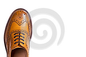 Extreme Closeup of Medalion of One Separate Male Tan Brogue Oxfords