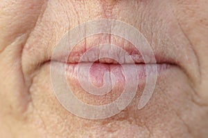 Extreme Closeup on the mouth of a middle-aged woman