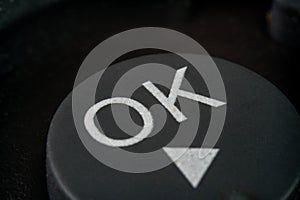 Extreme closeup of a ok button on TV remote