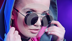 Extreme closeup sexy facial feminine in sunglasses dancing night disco party. 4k Dragon RED camera