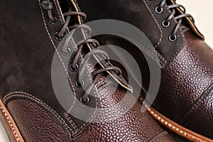 Extreme Closeup of Shoelaces of Premium Dark Brown Grain Brogue Derby Boots Made of Calf Leather with Rubber Sole Placed Over