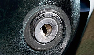 Extreme closeup shot of a car engine ignition switch panel.