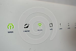 Extreme closeup shot of green lights on internet modem