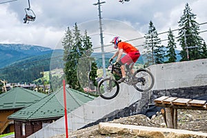 Extreme cyclist jumping from a springboard on a mountain bike. MTB