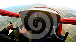 Extreme lesson on sports plane, POV of man looking at control panel, adrenaline