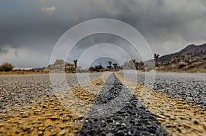 Extreme Low Angle of Desert Road on Stormy Day