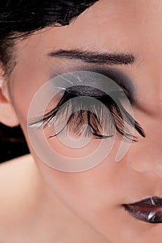 Extreme makeup with feather eyelashes