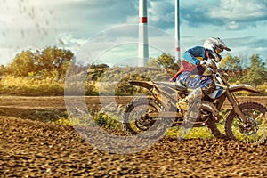 Extreme Motocross MX Rider riding on dirt track