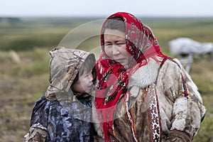 The extreme north, Yamal, the past of Nenets people, the dwelling of the peoples of the north, a family photo near the yurt in the