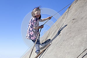 The extreme north, Yamal, the past of Nenets people, the dwelling of the peoples of the north, a girl playing near the yurts in