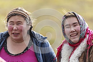 The extreme north, Yamal, the past of Nenets people, the dwelling of the peoples of the north, two women are smiling, sitting on a