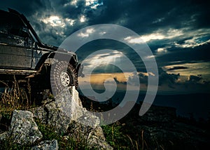 Extreme off road tour in a forest. Truck car wheel on offroad steppe adventure trail. Off road jeep expedition to the