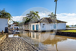 Extreme rainfall in Paraty, Brazil causes flooding in the river flowing on to the side streets