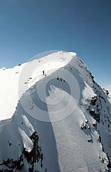Extreme skier at the top of a couloir on Corvatsch