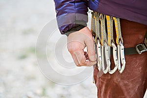 Quick-draws on the climber`s harness