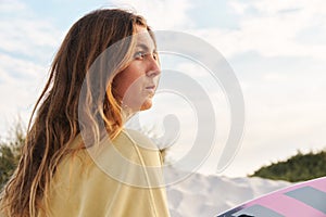 Extreme Sports Female Adventurer At The Beach Walking Up Sand Dunes With Surf Board Or Kite Surfing Sunset