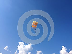 Extreme sports - the paratrooper lands on the ground