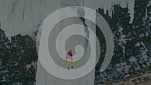 Extreme sportsmen climbing on Frozen Waterfall at Frozen Michigan waterfall