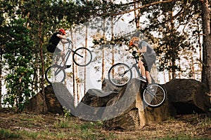 extreme trial bikers performing stunts