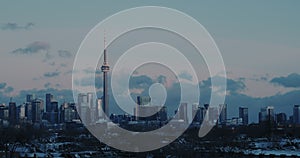 Extreme ultra wide view of Toronto skyline at dusk on winter day.