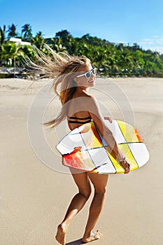 Extreme Water Sport. Surfing. Girl With Surfboard Beach Running.