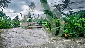 Extreme weather floods a house on Mindoro Island, Philippines. photo