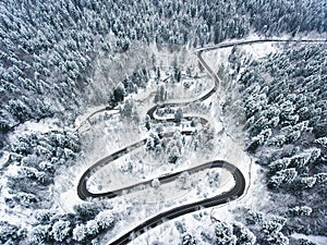 Extreme weather winding road in the winter covered with snow