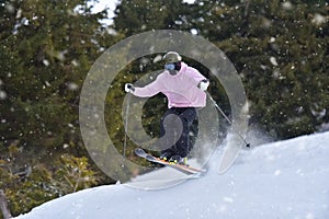 Extreme Winter Sports: Skier Takes on Gravity with Freestyle Skiing Skills. Skier Executes a Perfect Jump with Ease