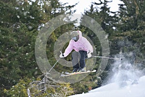 Extreme Winter Sports: Skier Takes on Gravity with Freestyle Skiing Skills. Skier Executes a Perfect Jump with Ease