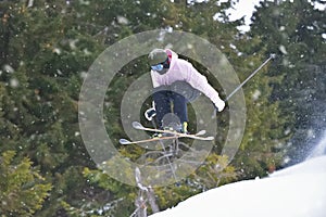 Extreme Winter Sports: Skier Takes on Gravity with Freestyle Skiing Skills. Skier Executes a Perfect Jump with Ease